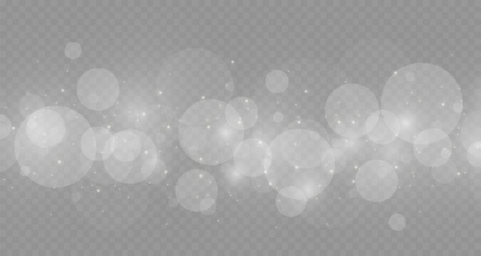 Dust sparks and stars shine with a special light. Christmas light effect. Glittering particles of magic dust.Vector sparkles on a transparent background.