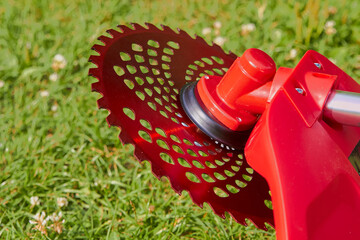 brush cutter with a cutting disc,mowing grass with a brushcutter, a new trimmer for mowing grass...