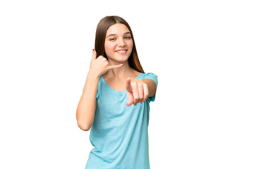 Obraz na płótnie Canvas Teenager girl over isolated chroma key background making phone gesture and pointing front