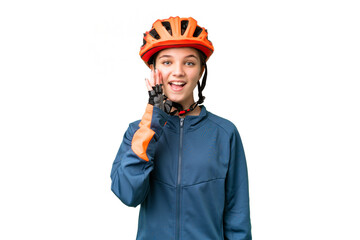 Teenager cyclist girl over isolated chroma key background with surprise and shocked facial expression