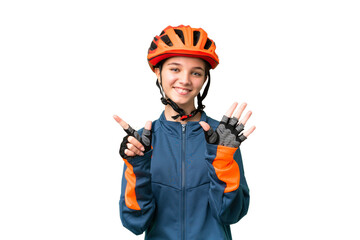 Teenager cyclist girl over isolated chroma key background counting seven with fingers