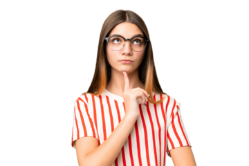 Teenager girl over isolated chroma key background With glasses and looking up
