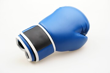 Single blue boxing glove isolated on a white background