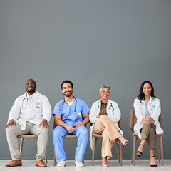 Healthcare, doctors and portrait of team on chair on wall background for insurance, wellness and...