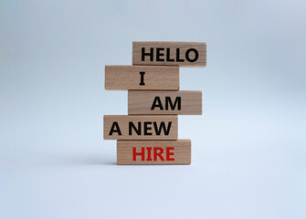 Hello I am a new hire symbol. Concept words Hello I am a new hire on wooden blocks. Beautiful white background. Business and Hello I am a new hire concept. Copy space.