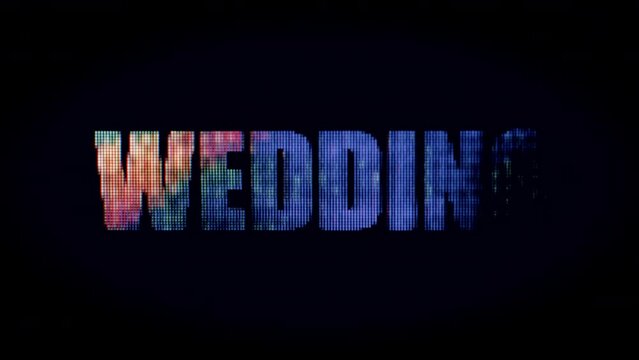 Flashing "WEDDING" sign with colorful lights against a black background
