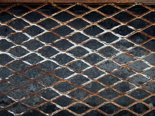 Fototapeta premium old steel grating of drain with rust in street floor