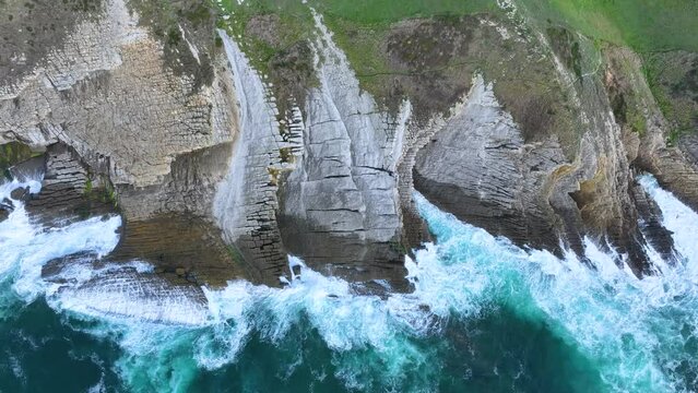 Coastal landscape of cliffs, meadows and sea in the area of Punta Ballota between Tagle and Ubiarco. Aerial view from a drone. Cantabrian Sea. Cantabria, Spain, Europe