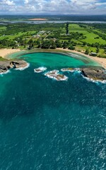 Vertical shot of a beautiful sea on a sunny summer day