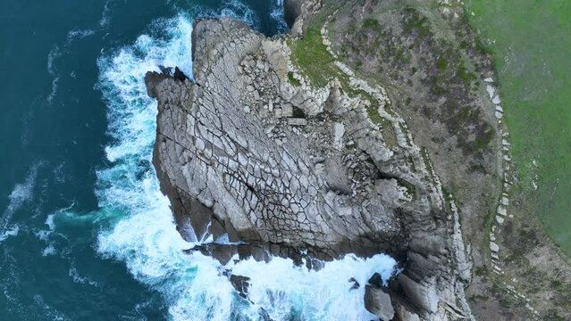 Coastal landscape of cliffs, meadows and sea in the area of Punta Ballota between Tagle and Ubiarco. Aerial view from a drone. Cantabrian Sea. Cantabria, Spain, Europe