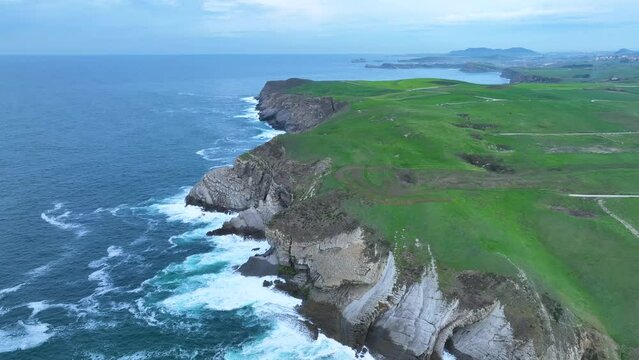 Coastal landscape of cliffs, meadows and sea in the area of Punta Ballota between Tagle and Ubiarco. Aerial view from a drone. Cantabrian Sea. Cantabria, Spain, Europe