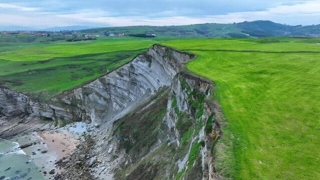 Coastal landscape of cliffs, meadows and sea in the area of Punta Ballota between Tagle and Ubiarco. Aerial view from a drone. Cantabrian Sea. Cantabria, Spain, Europe