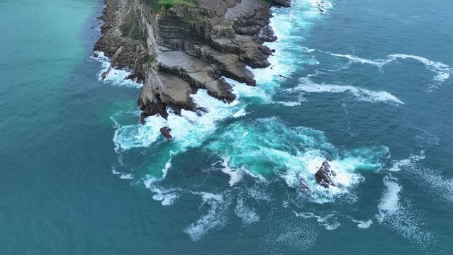 Coastal landscape of cliffs, meadows and sea in the area of Punta Ballota between Tagle and Ubiarco. Aerial view from a drone. Cantabrian Sea. Cantabria, Spain, Europe
