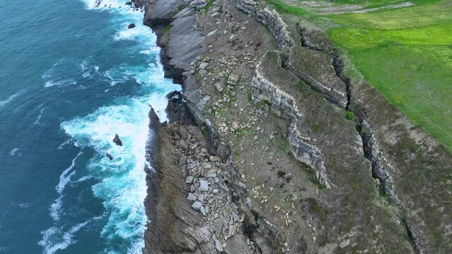 Coastal landscape of cliffs, meadows and sea in the area of Punta Ballota between Tagle and Ubiarco. Aerial view from a drone. Cantabrian Sea. Cantabria, Spain, Europe