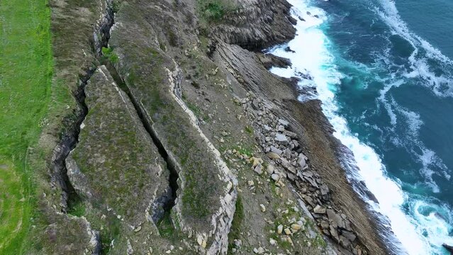 Coastal landscape of cliffs, meadows and sea in the area of Punta Ballota between Tagle and Ubiarco. Aerial view from a drone. Cantabrian Sea. Cantabria, Spain, Europe