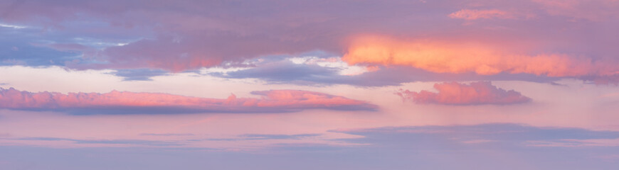 Fototapeta na wymiar Beautiful panoramic sky with glowing clouds at sunset