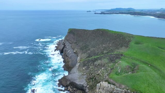 Coastal landscape of cliffs, meadows and sea in the area of Punta Ballota between Tagle and Ubiarco. Aerial view from a drone. Cantabrian Sea. Cantabria, Spain, Europe