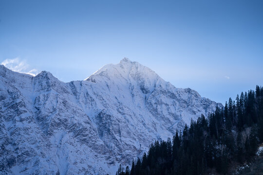 beautiful light rays coming from sunset behind snow covered peaks near atal tunnel lahul spiti leh ladakh