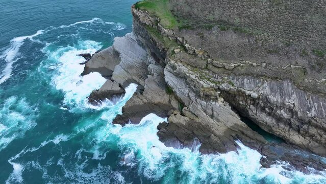 Coastal landscape of cliffs, meadows and sea in the area of Punta Ballota between Tagle and Ubiarco. Aerial view from a drone. Cantabrian Sea. Cantabria, Spain, Europe