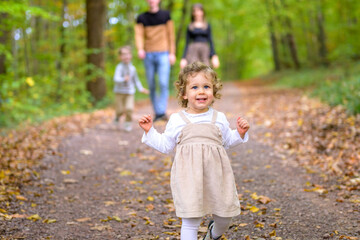 Little laughing girl in the forest