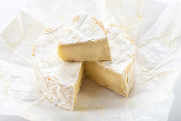Camembert cheese on white background.