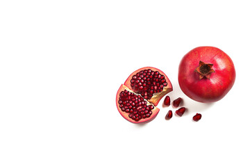 Top view exotic and delicious whole and part of pomegranate on white background with copy space. Created with Generative AI Technology