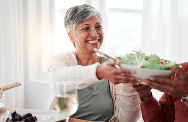 Family dinner, senior woman and salad of a happy female with heathy food in a home. Celebration,...