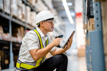 Warehouse workers use scanner checking and scan the barcode of stock inventory to keep storage in a system, Smart warehouse management system, Supply chain and logistic network technology concept.