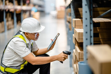 Warehouse workers use scanner checking and scan the barcode of stock inventory to keep storage in a system, Smart warehouse management system, Supply chain and logistic network technology concept. - obrazy, fototapety, plakaty