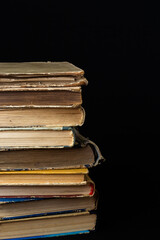 Stack of hardcover old books with on a dark background. Bookshelf shop, Knowledge publications, literature. Bookish bookstore bookstore