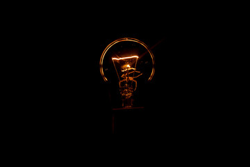 Incandescent lamp on a black background