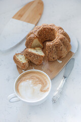 Food photography of cupcake, cake with raisins, nuts, cappuccino, coffee, baking, dessert.