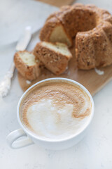 Food photography of cupcake, cake with raisins, nuts, cappuccino, coffee, baking, dessert.