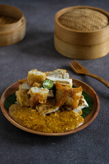 batagor is astreet food very popular in Indonesia, is one of the local food served with fish cake, tofu and peanut sauce