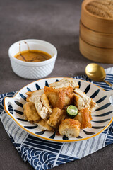 batagor is astreet food very popular in Indonesia, is one of the local food served with fish cake, tofu and peanut sauce