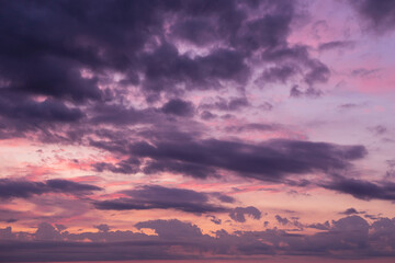 Fototapeta na wymiar Epic dramatic sunrise, sunset pink violet orange sky with clouds background texture