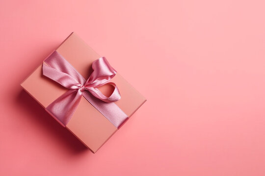 Gift box with pink satin ribbon and bow on pink background. Holiday gift with copy space. Birthday or Christmas present, flat lay, top view. Christmas giftbox concept. AI generated image