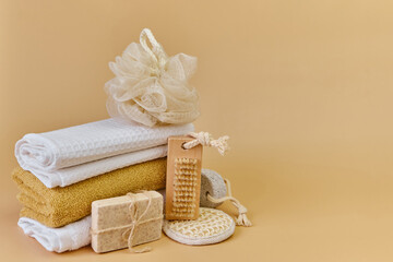 Various eco frendly items from bathroom for face and body care and hygiene on beige background with Copy space. Zero waste concept.