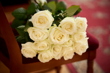 Fototapeta premium wedding bouquet of white roses. White roses Flower composition. Luxury bouquet of fresh roses. Beautiful white wedding bouquet.