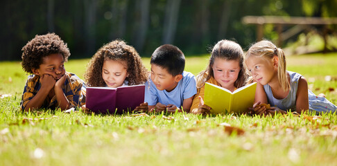 Children, books and lying in park with friends, learning or diversity for reading at school...