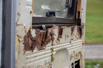Heavy Rust at the backdoors of an Oldtimer Camper truck from 1978 before restoration, with multiple...