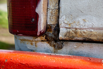 Heavy Rust at the backdoors of an Oldtimer Camper truck from 1978 before restoration, with multiple...