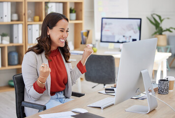 Happy woman winning on computer in success, bonus or celebration for news, sales and business cheers in office. Yes of happy winner or Asian person celebrate, fist pump and reading opportunity on pc