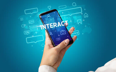 Hand using smartphone with social media concept