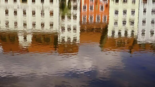 Water reflections of the colorful facades of Zgorzelec. abstract-looking shots of the blurred reflections.