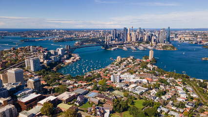 Fototapeta premium Aerial drone panoramic view of Sydney City and Sydney Harbour looking from above North Sydney on a sunny morning in April 2023 