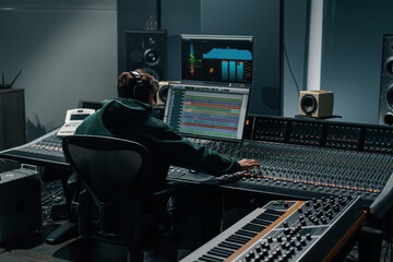 Sound engineer used digital audio mixer Sliders Engineer presses keys Control panel Recording...
