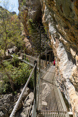 Hanging walkways nailed into the rock that runs inside the Vero river canyon in Alquezar, Aragon, Spain.