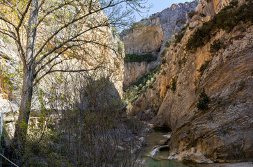 Hanging walkways nailed into the rock that runs inside the Vero river canyon in Alquezar, Aragon, Spain.