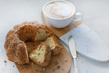 Food photography of cupcake, cake with raisins, nuts, cappuccino, coffee, baking, dessert.